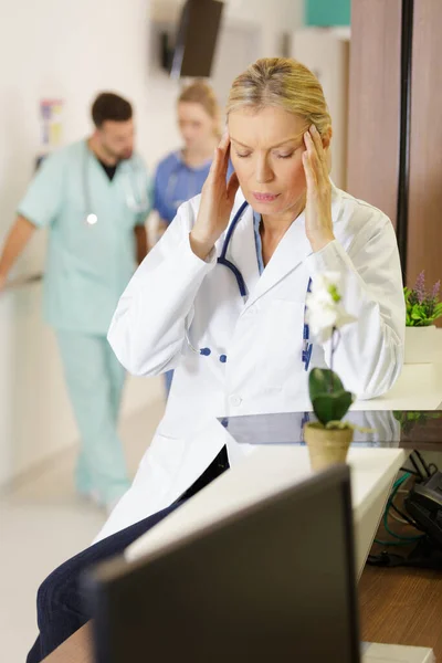 Female Doctor Suffering Headache — Stock Photo, Image