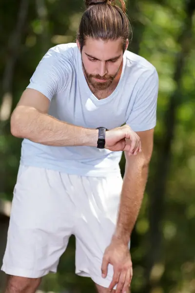 Man Checking His Stopwatch — Stock Photo, Image