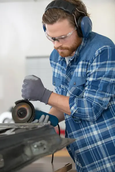 Man Mechanical Worker Repairing Electric Grider — Stock Photo, Image