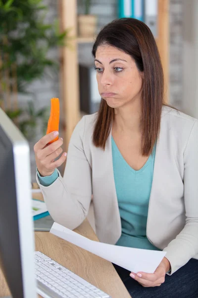 Woman Holding Carrot Working Office — Stock Photo, Image