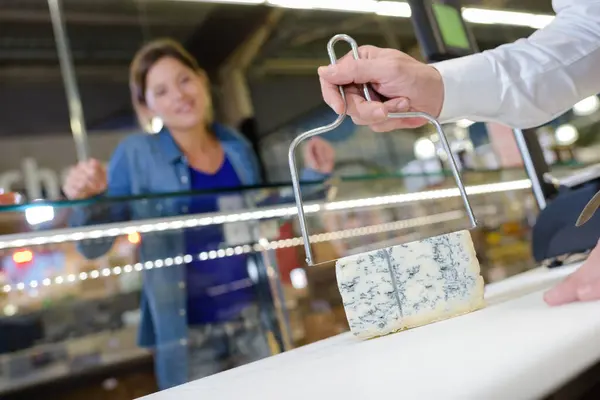 Cheese Being Cut Customer — Stock Photo, Image