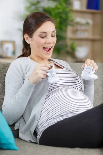 Pregnant Wife Keeps Little Baby Boots — Stock Photo, Image