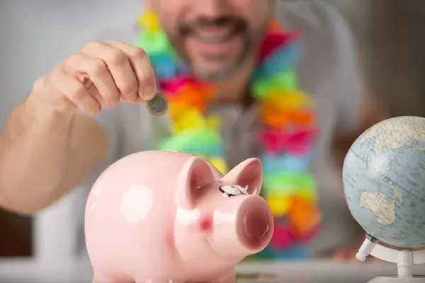 Man Saving Piggy Bank — Stock Photo, Image