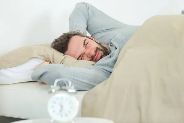 Sleepy Man Holding Alarm Clock Bed — Stock Photo, Image