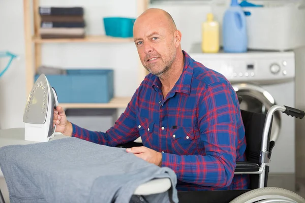 Mature Disabled Man Ironing — Stock Photo, Image