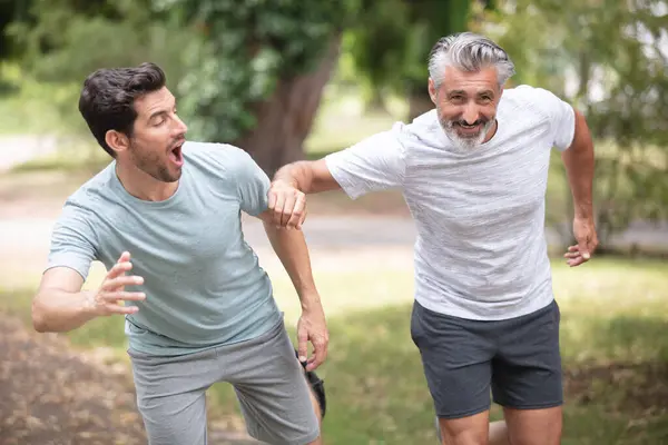 two healthy men jogging in the morning