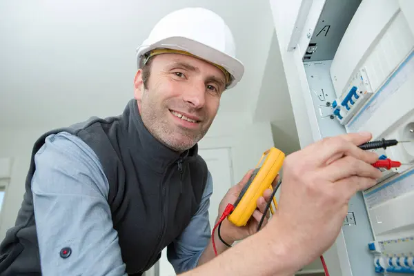 Electrician Measuring Voltage Distribution Board — Stock Photo, Image