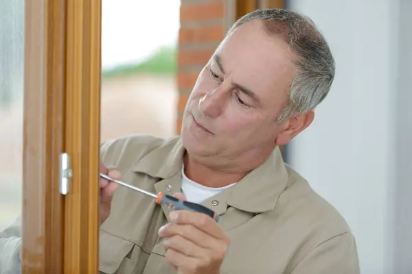Man Screwing Repairing Door Handle — Stock Photo, Image