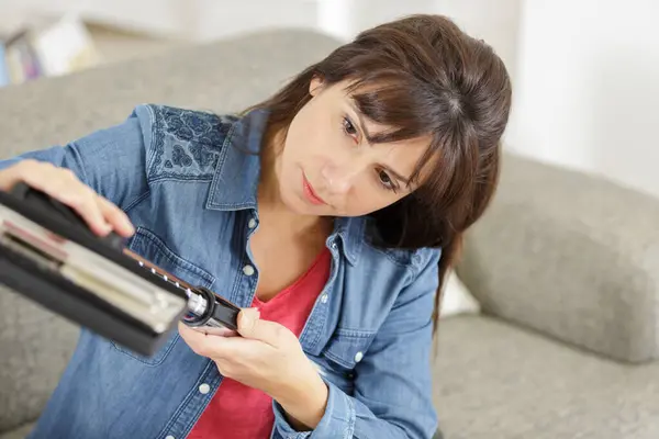 Woman Reluctantly Cleans Vacuum Cleaner — Stock Photo, Image
