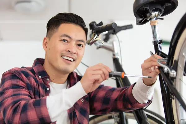 Young Man Repairing Bicycle Spanner — Stock Photo, Image