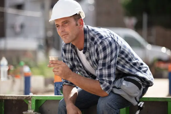 worker on a break drinking coffee and having a rest