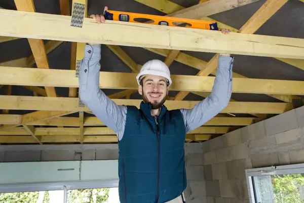 Happy Male Construction Worker Adjusting Ceiling — Stock Photo, Image