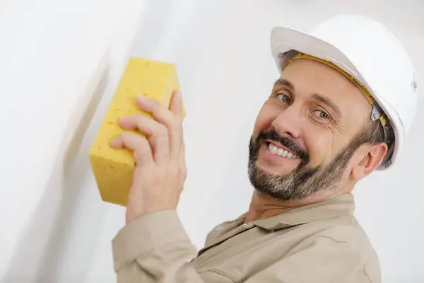 Happy Male Builder Washing Wall Plastering Telifsiz Stok Fotoğraflar