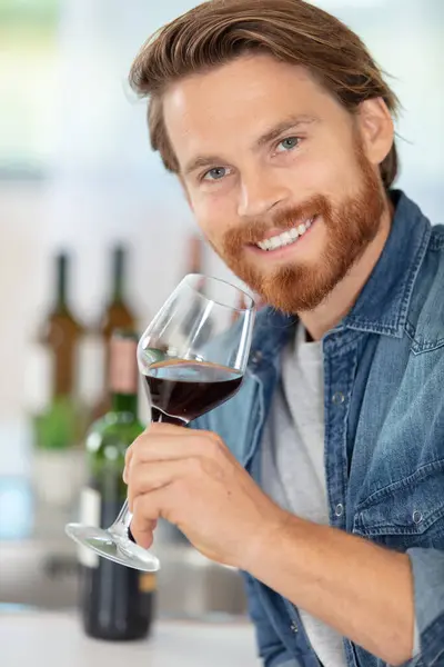 Man Tasting Glass Red Wine Home — Stock Photo, Image