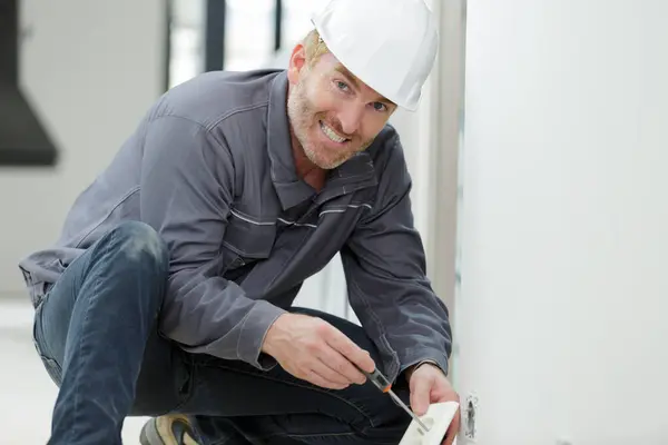 Portrait Mature Male Electrician Installing Socket — Stock Photo, Image