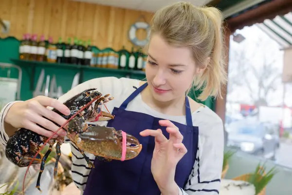 Female Fishmonger Holding Lobster — Stock Photo, Image