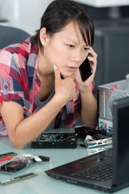 computer engineer with laptop smartphone and dismantled pc clipart