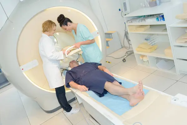 stock image nurses preparing equipment for mri scan