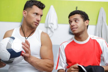 picture of football coach and player having conversation clipart