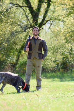 hunter with dog and man clipart