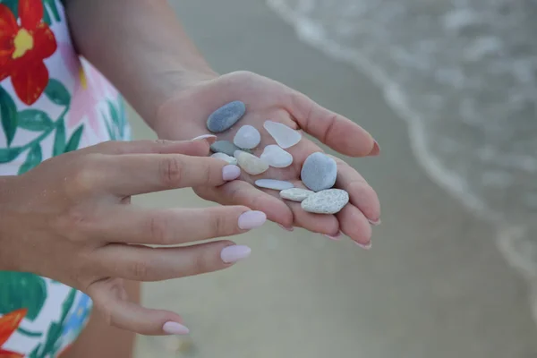 Woman Collecting Pebbles Beach — ストック写真