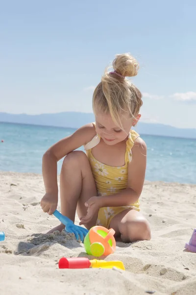 Cute Happy Years Old Girl Playing Plastic Toys Sandy Beach — стоковое фото