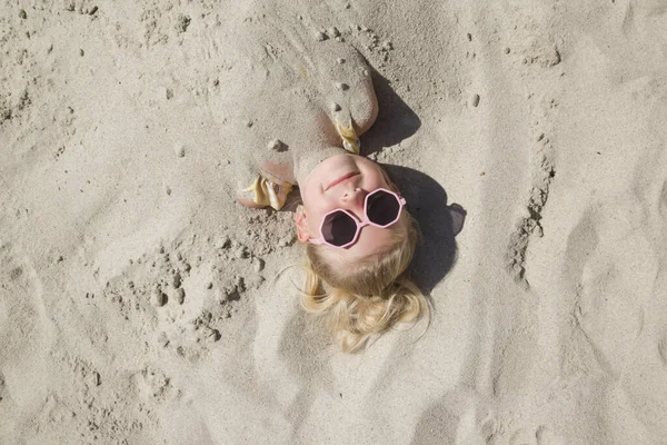 Cute Happy Little Girl Buried Sand Beach —  Fotos de Stock