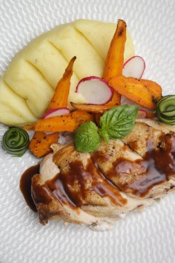 Pork ribs with grilled vegetables and mashed potatoes