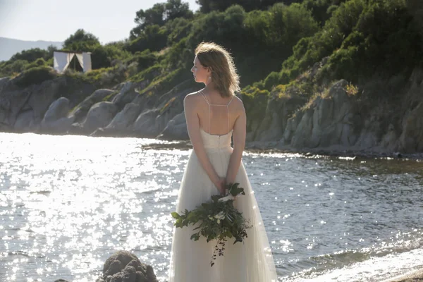 Bride Long White Wedding Dress Standing Windy Sea Rock Shore — Stockfoto
