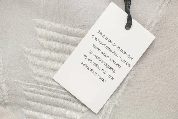 Close Luxury Clothing Hang Tag Delicate Garment Swing Tag Laundry — Stock Photo, Image