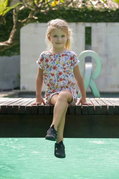 Cute Little Girl Floral Dress Sitting Swimmingpool Bridge — Stock Photo, Image