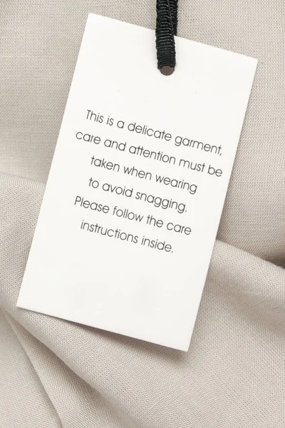 Close Luxury Clothing Hang Tag Delicate Garment Swing Tag Laundry — Stock Photo, Image