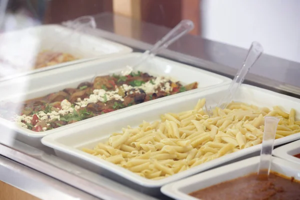 stock image Various food served on a buffet line