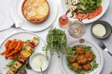 Various Mediterranean dishes served on the restaurant table