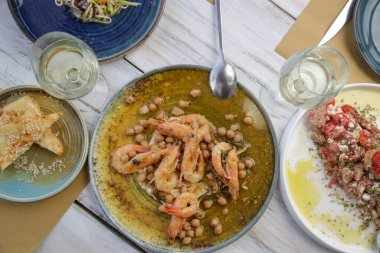 Various Mediterranean dishes served on the restaurant table