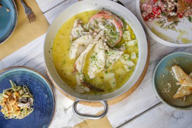 Various Mediterranean dishes served on the restaurant table