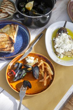 Various Mediterranean dishes served on the restaurant table