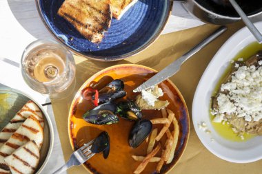 Various Mediterranean dishes served on the restaurant table