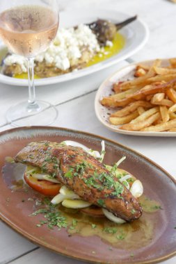 Various Mediterranean dishes served on the restaurant table