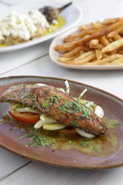 Various Mediterranean dishes served on the restaurant table