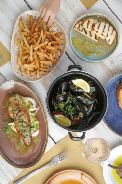 Various Mediterranean dishes served on the restaurant table