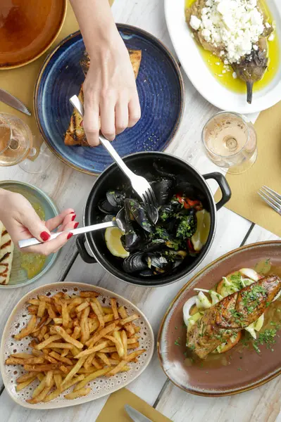 Various Mediterranean dishes served on the restaurant table