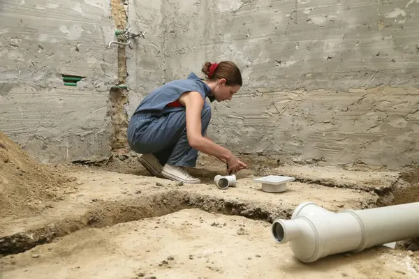 stock image Process of installing PVC pipes sewage system in bathroom, DIY home renovation