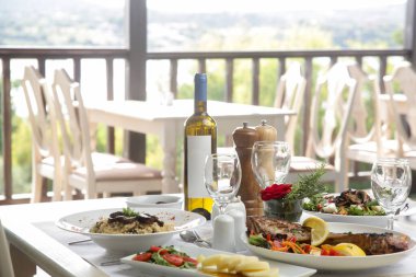Various Mediterranean dishes served on the restaurant table