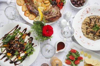 Various Mediterranean dishes served on the restaurant table