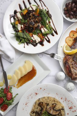 Various Mediterranean dishes served on the restaurant table
