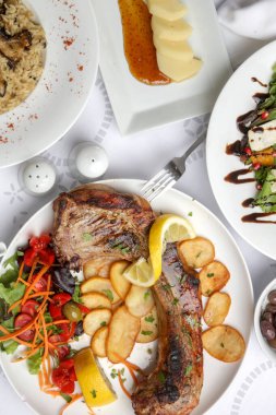Various Mediterranean dishes served on the restaurant table