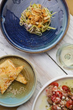 Various Mediterranean dishes served on the restaurant table