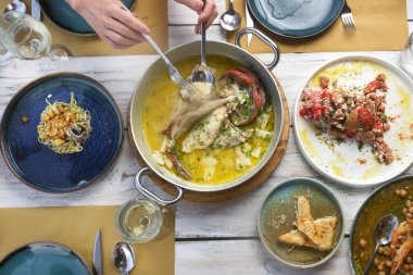 Various Mediterranean dishes served on the restaurant table