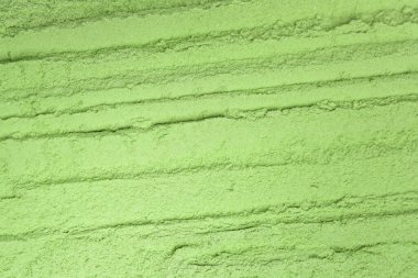 Yeşil toz desenli arka plan. Besin takviyesi, diyet, detoks, önleyici sağlık ve sağlıklı yaşam tarzı kavramı.